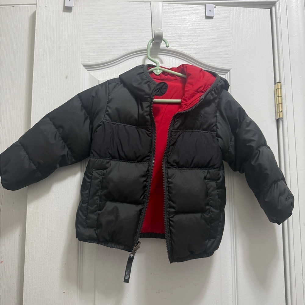 The North Face Kids Black and Red Puffer Jacket. Two-sided black and red